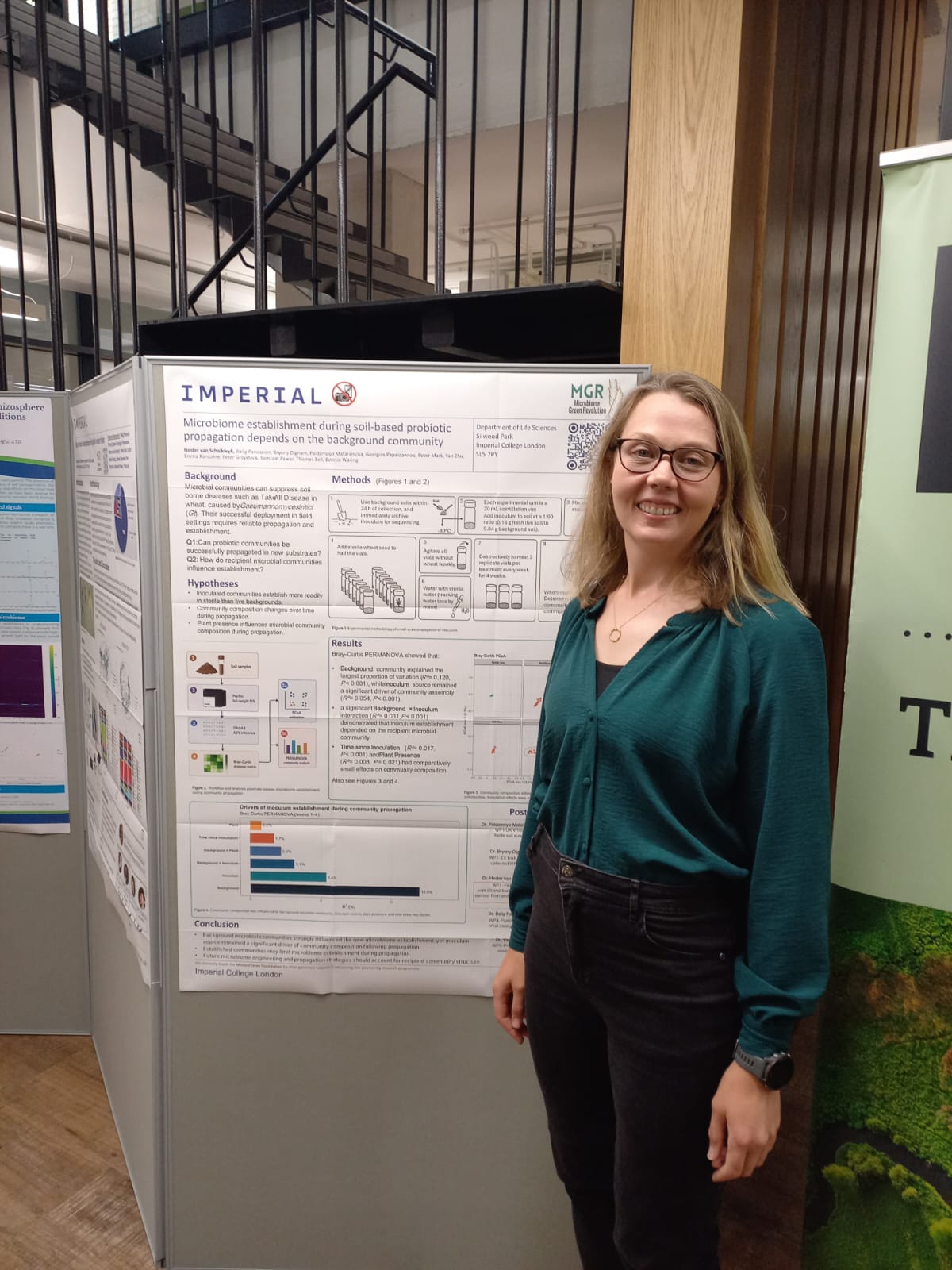 Dr Hester van Schalkwyk standing beside her bioinoculant research poster at the BES conference