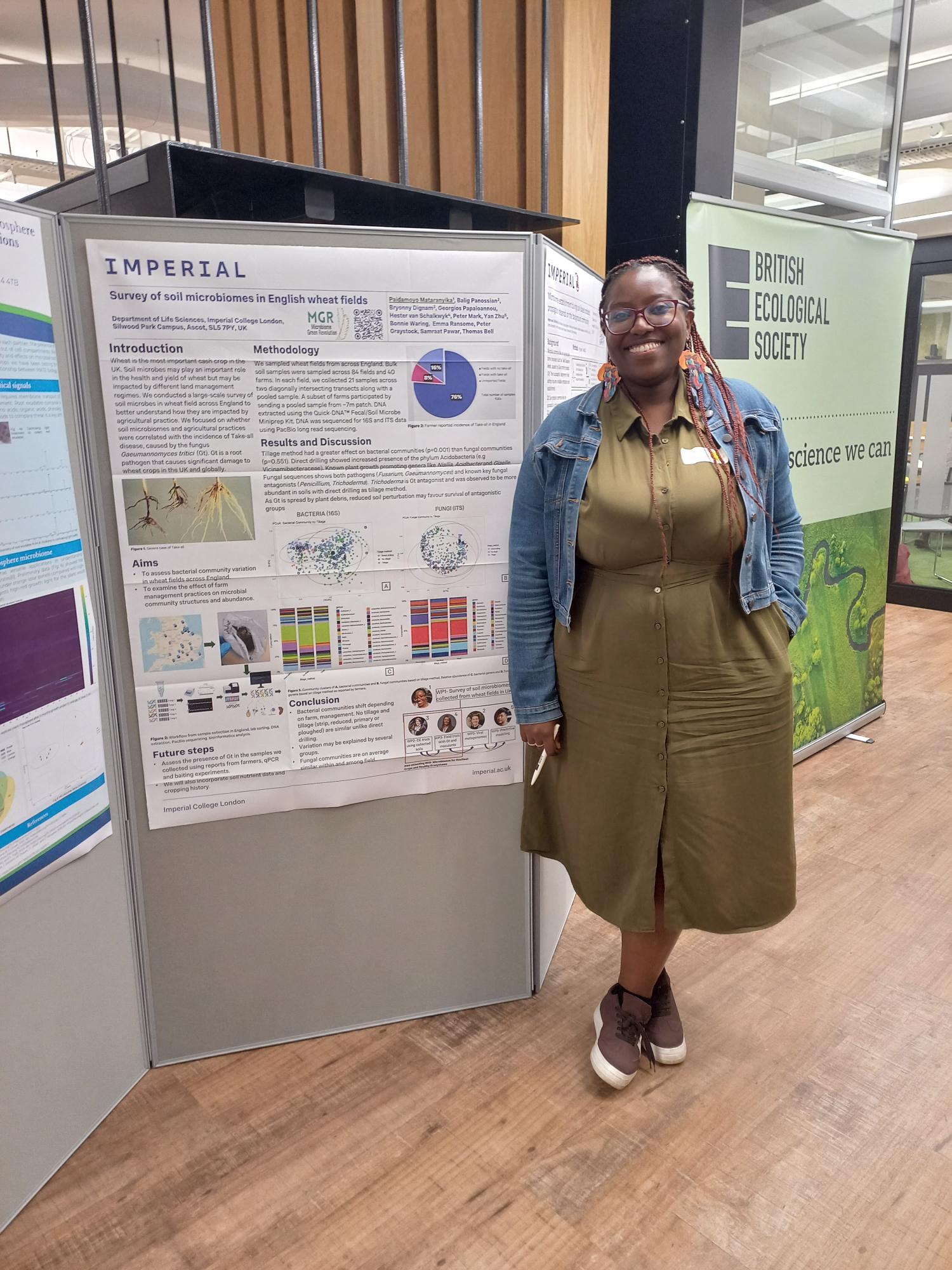 Dr Paida Mataranyika standing beside the MGR soil microbiome survey poster at the BES conference